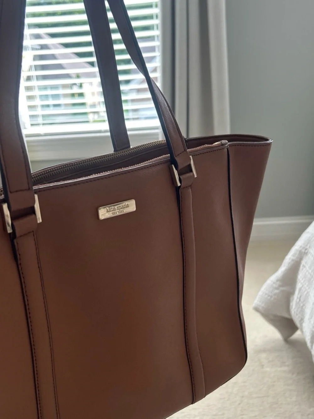 kate spade brown leather tote with gold-tone plaque